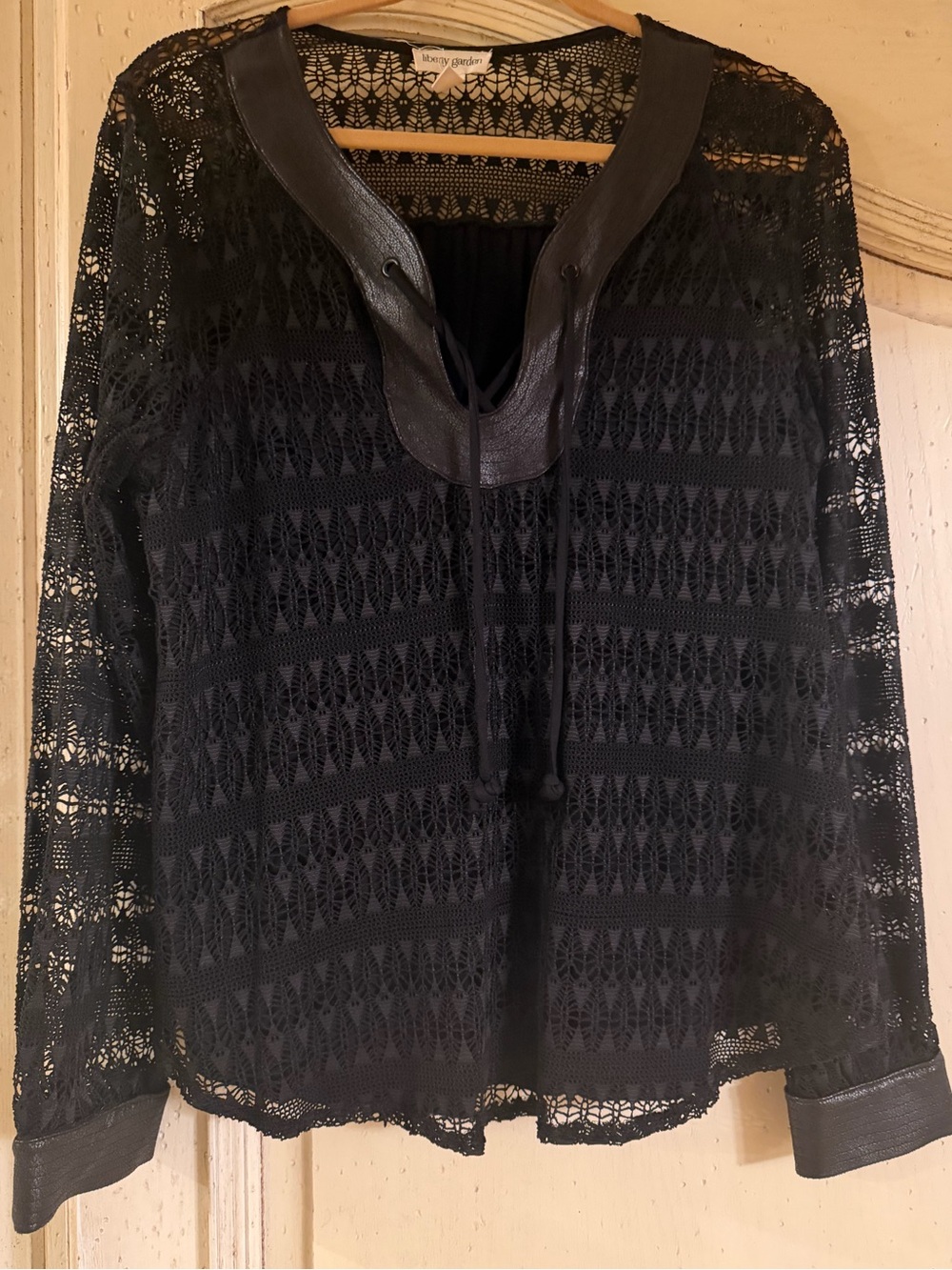 Black Lace top, faux leather trim, tie front. Size L great condition